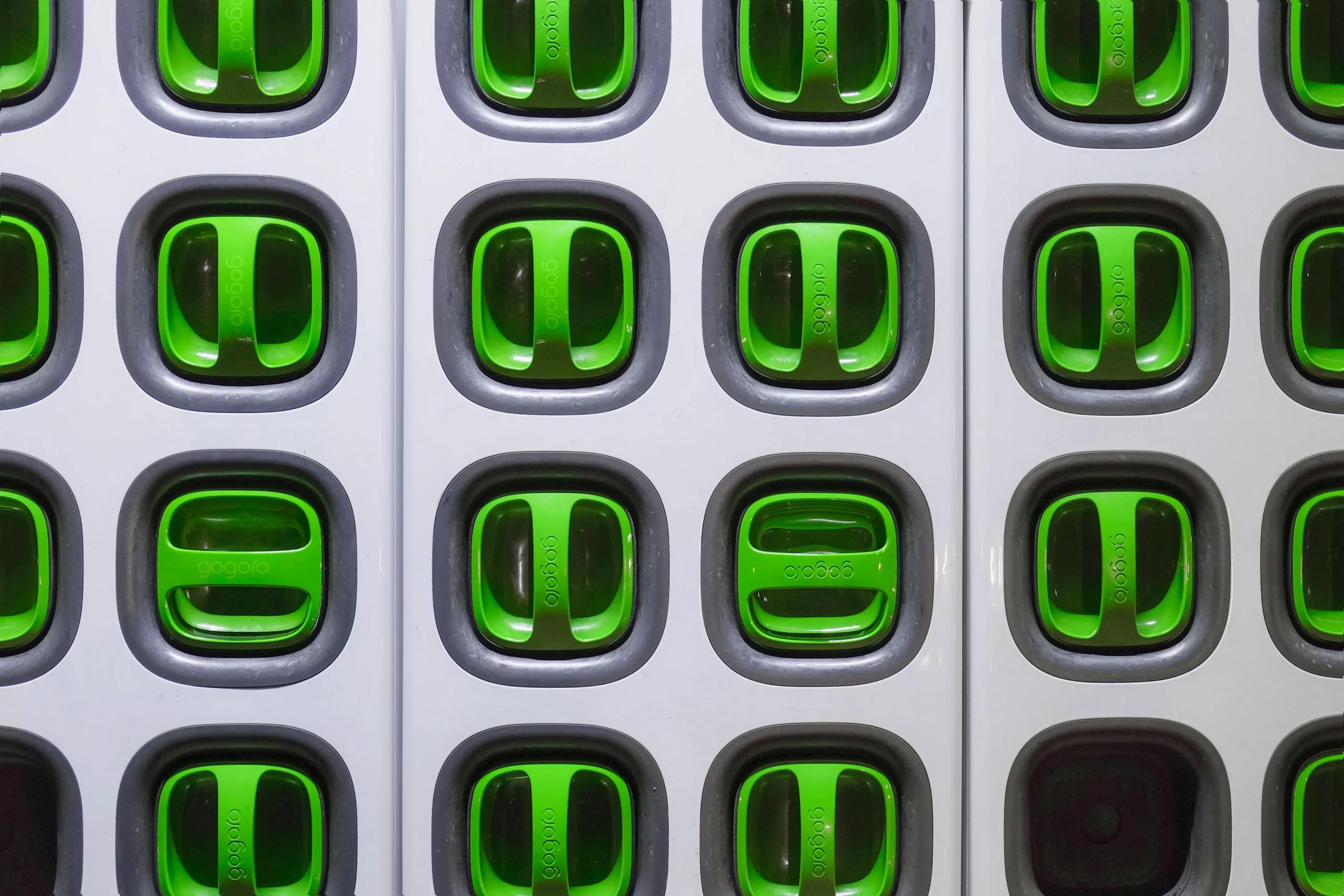 Grey plastic doors with green handles.