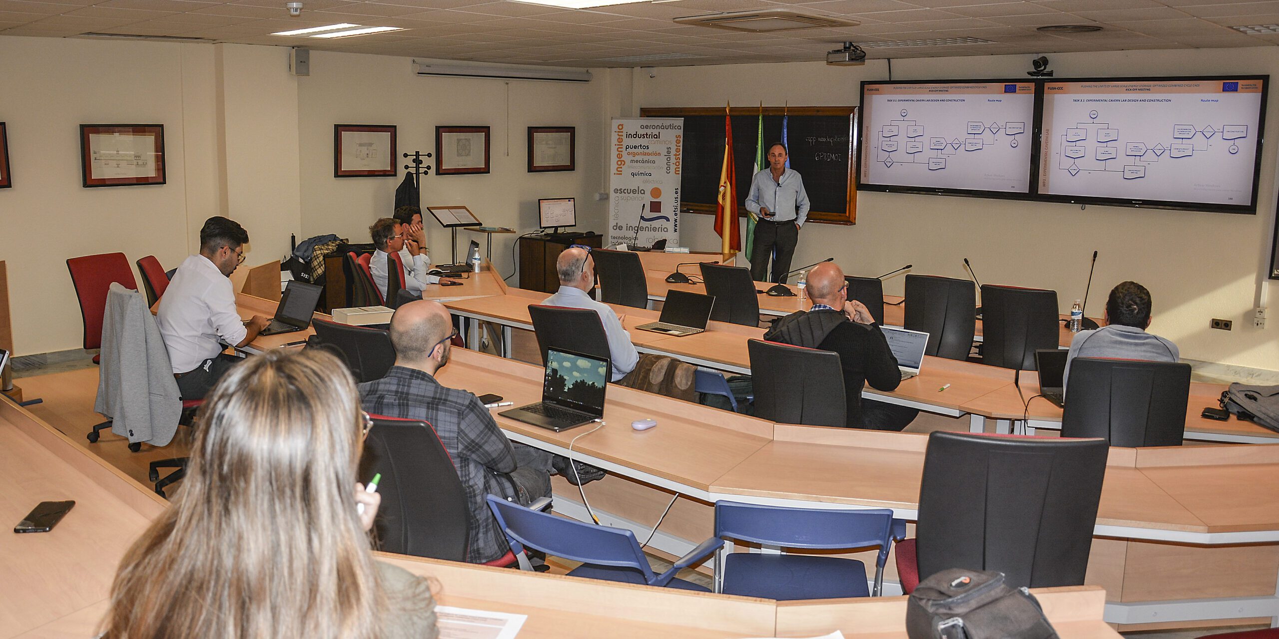 Attendees gathered in a conference room during the project Kick-Off Meeting, engaged in discussions and presentations.